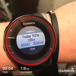 Garmin wristwatch displaying running time and distance