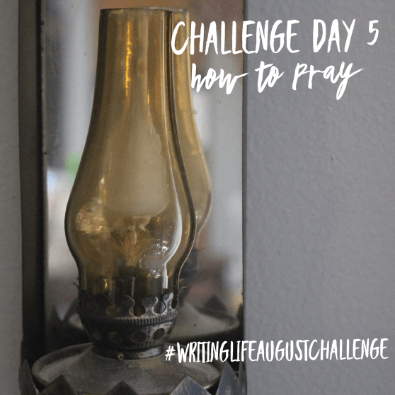 Oil-wick lantern hanging on a wall. Photo text: Challenge Day 5, #writinglifeaugustchallenge