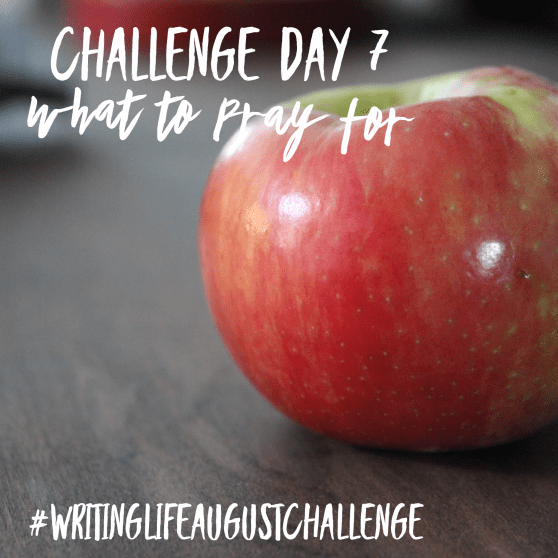 Red apple sitting on a table. Photo text: Challenge Day 7, what to pray for. #writinglifeaugustchallenge
