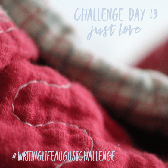Close-up shot of rumpled red quilt back against a pale background. Photo text: Challenge Day 19, just love. #writinglifeaugustchallenge